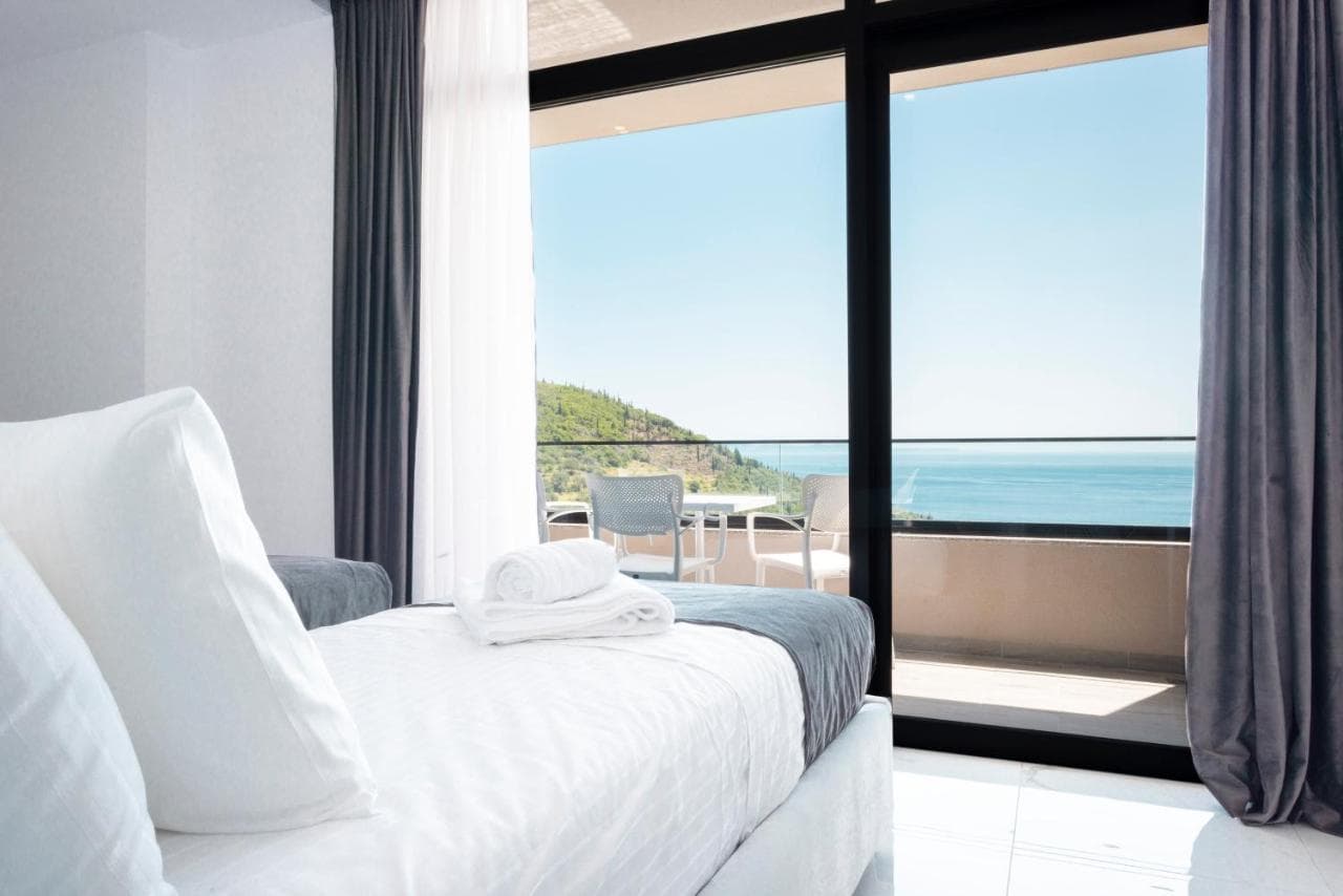 Deluxe double room looking out to a sea-view balcony